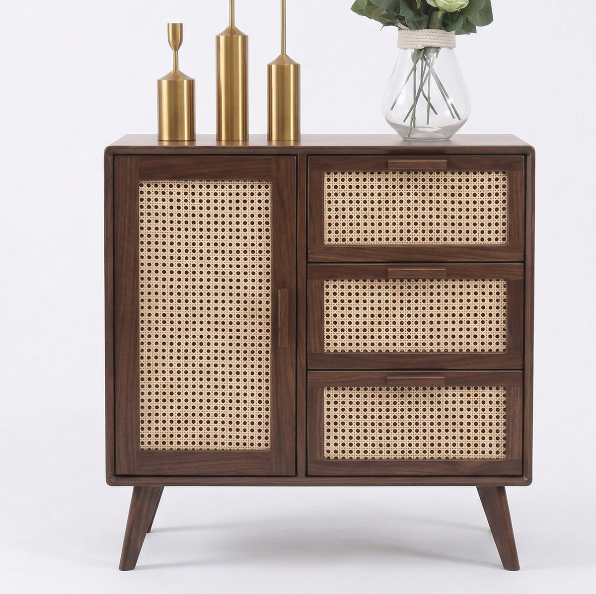 Wooden cabinet with rattan doors and drawers on a white background