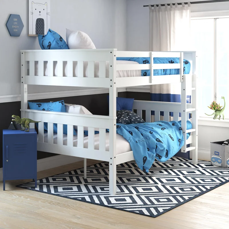 A gray and white bunk bed with lights on in one of the beds, surrounded by pillows and a bookshelf in a cluttered room setup.