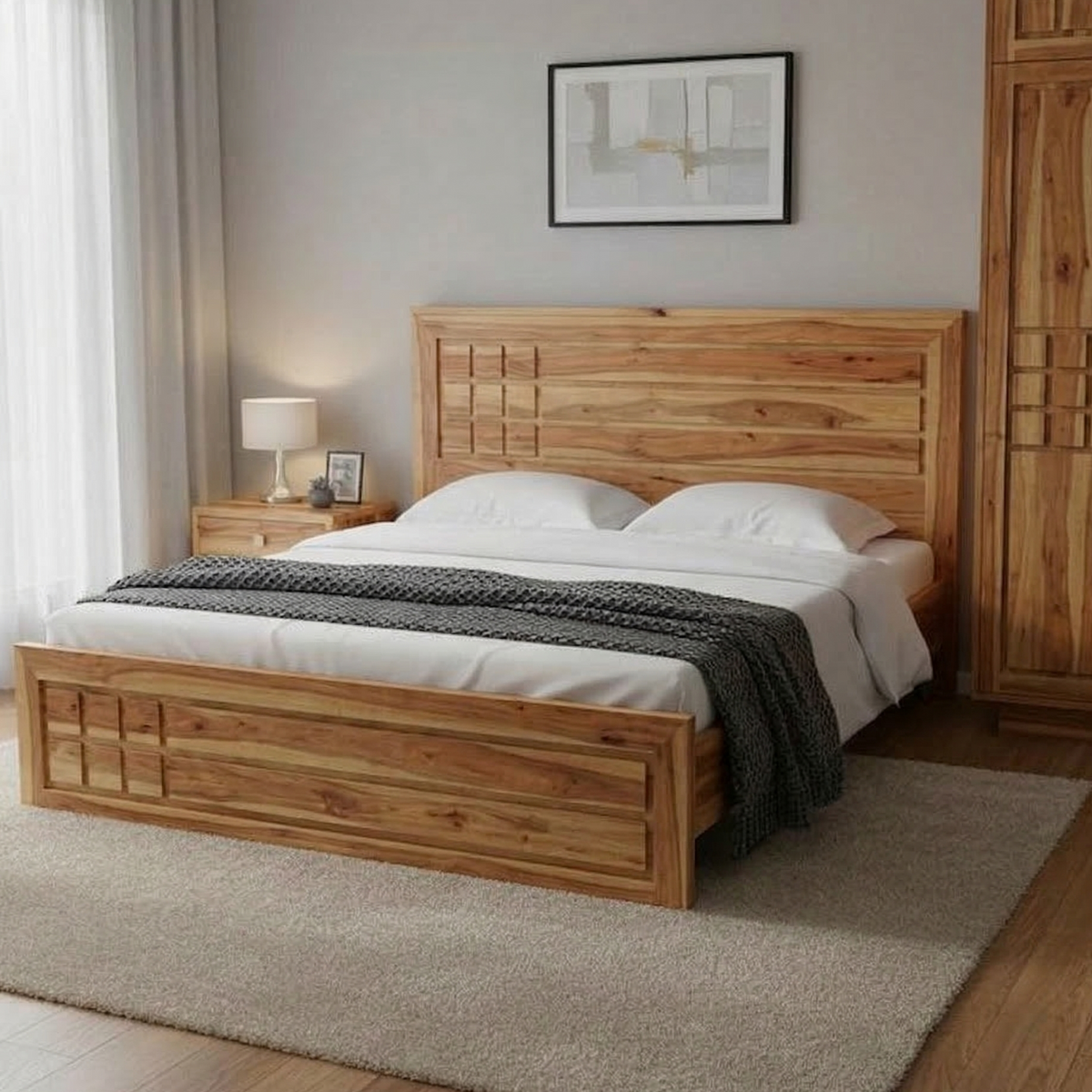Wooden bed in a bedroom with a lamp and artwork on the wall.