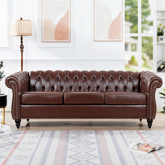 Brown leather sofa in a living room setting with decor elements.
