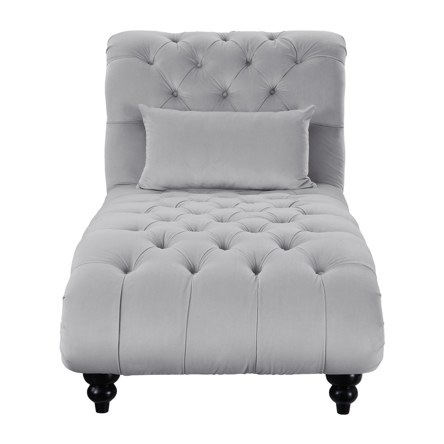 Gray tufted chaise lounge with a pillow on a white background
