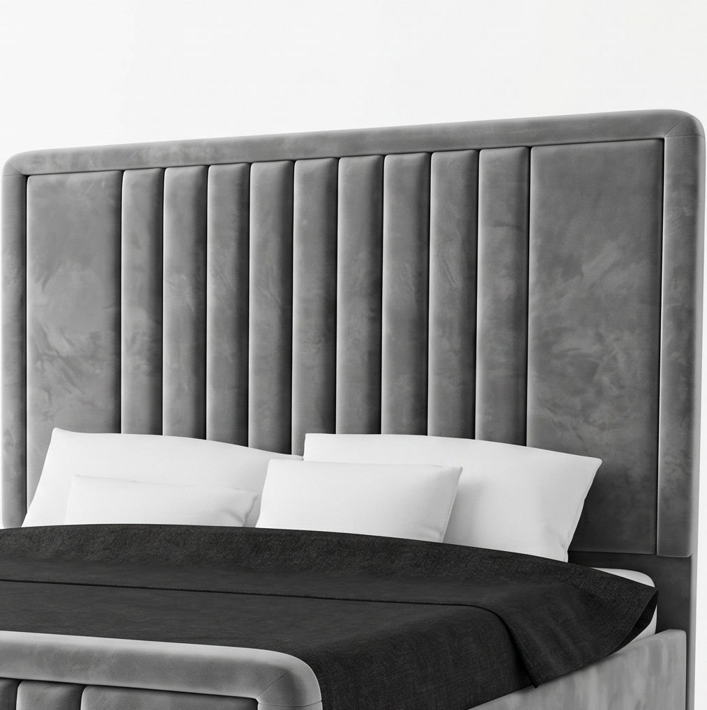 Gray upholstered bed with white pillows and black bedding on a bed.