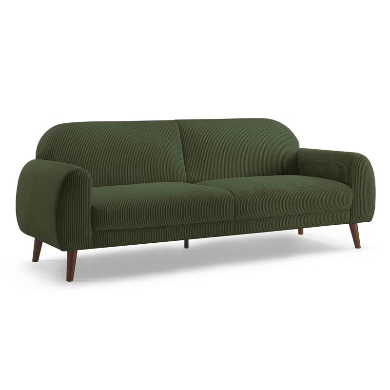 Green sofa with wooden legs on a white background