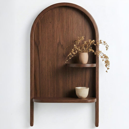 Wooden arch-shaped shelf with two ceramic bowls and dried flowers on a white background