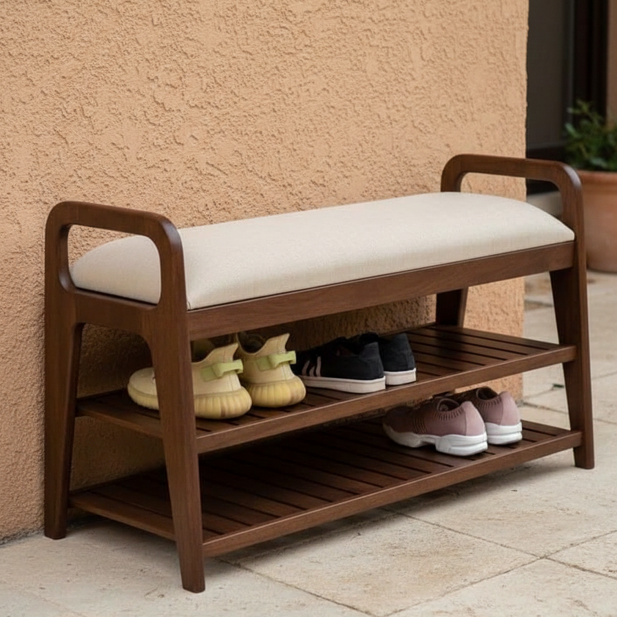 Wooden shoe bench with cushioned seat and shoe storage shelves against a beige wall.
