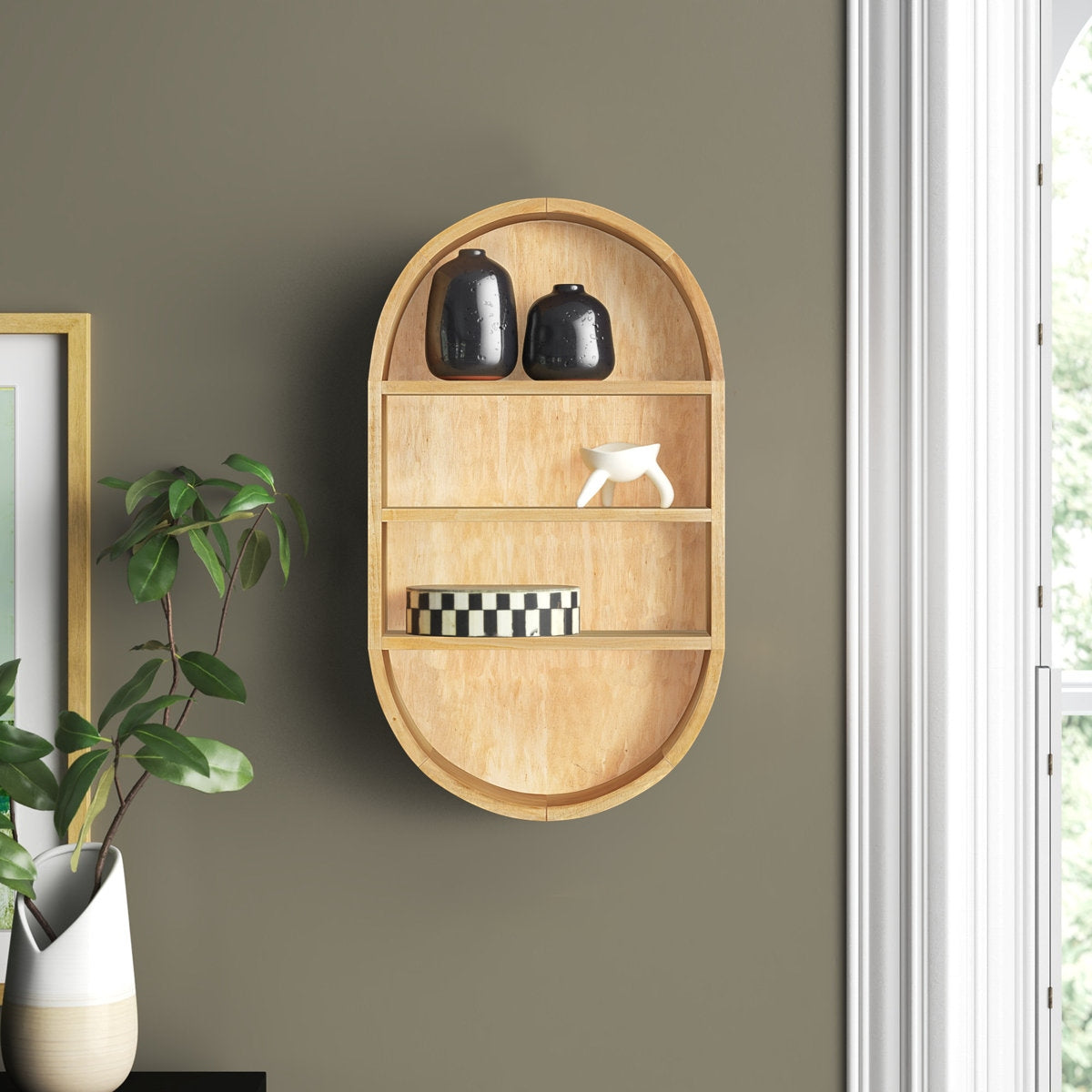 Wooden wall shelf with decorative items against a gray wall