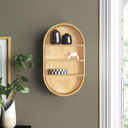 Wooden wall shelf with decorative items against a gray wall