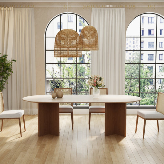Modern dining room with a wooden table and chairs, large windows, and decorative elements.