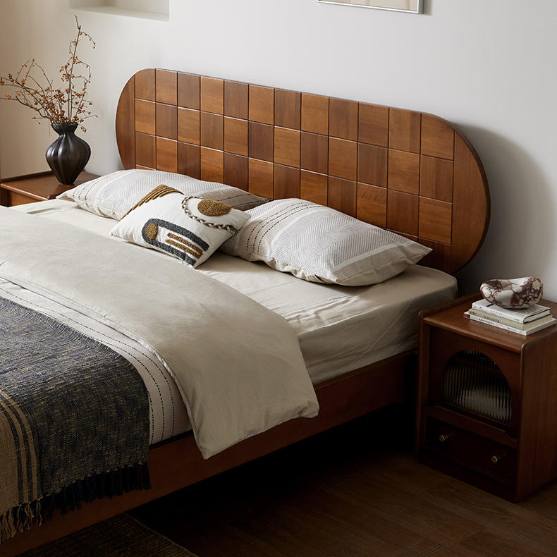 Bedroom with wooden headboard and nightstands
