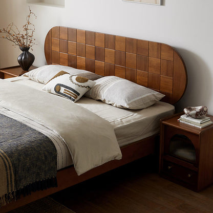 Bedroom with wooden headboard and nightstands