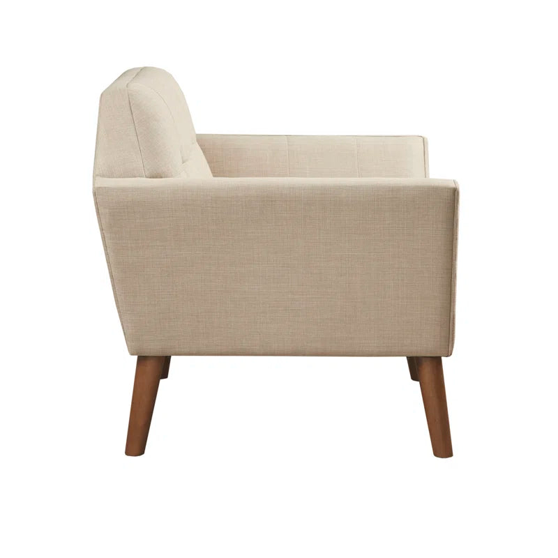Beige armchair with wooden legs on a white background