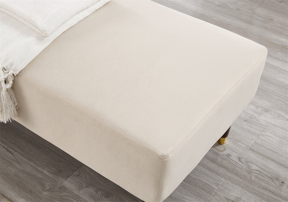 Beige ottoman with tassels on a wooden floor