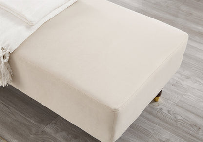 Beige ottoman with tassels on a wooden floor