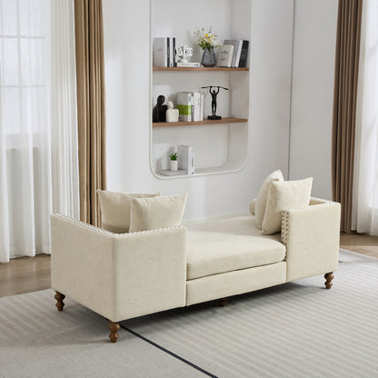 Beige sofa in a living room with a shelf and curtains
