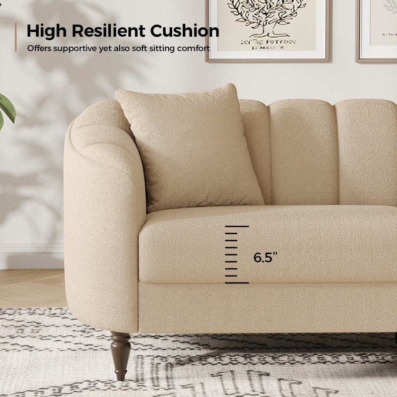 Beige sofa with a high resilient cushion and measurement label in a living room setting.