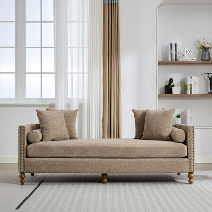 Beige sofa with cushions in a living room setting