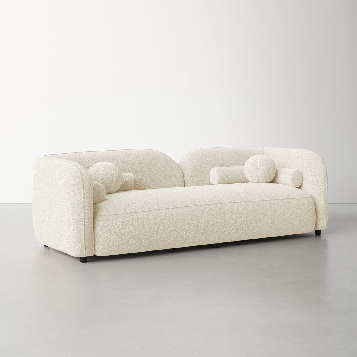 Beige sofa with spherical armrests on a light gray background