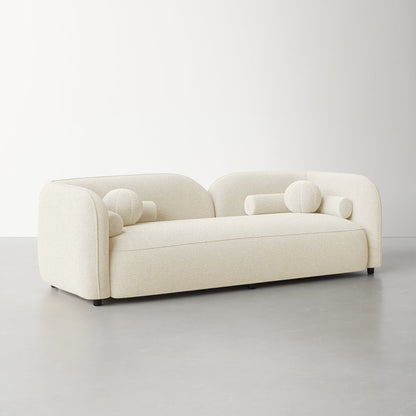 Beige sofa with spherical armrests on a light gray background
