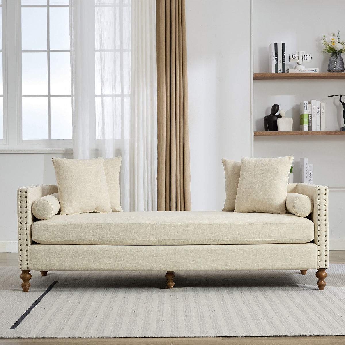 Beige sofa with wooden legs in a living room setting