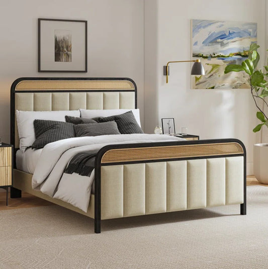 Beige upholstered bed with black metal frame in a bedroom setting