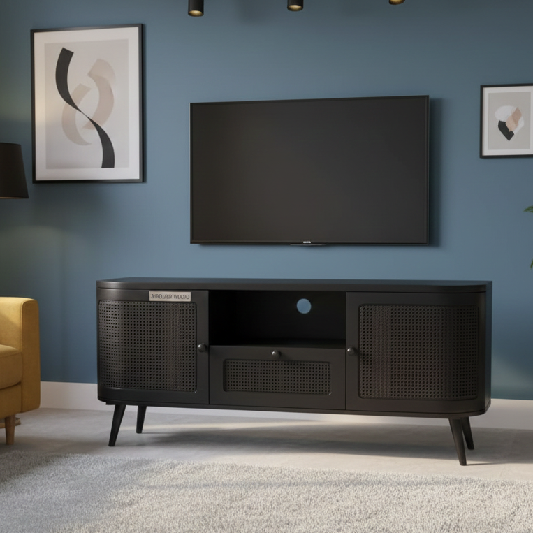 Black TV stand with a television mounted on a blue wall in a living room setting.