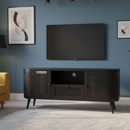 Black TV stand with a television mounted on a blue wall in a living room setting.