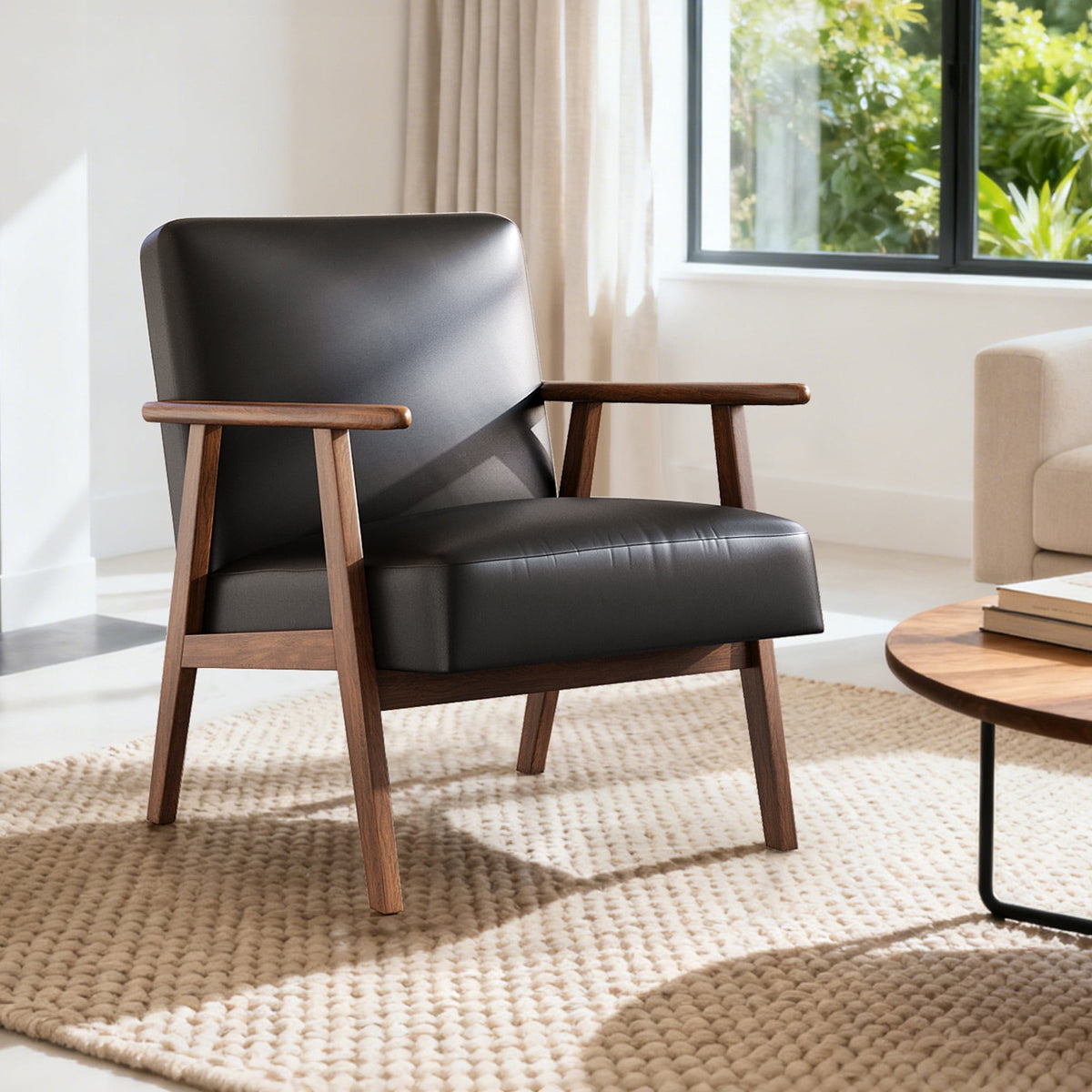 Black leather armchair with wooden frame in a bright living room