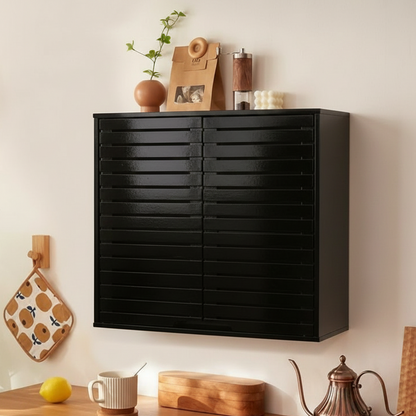 Black wall-mounted cabinet with kitchen items on a light-colored wall.