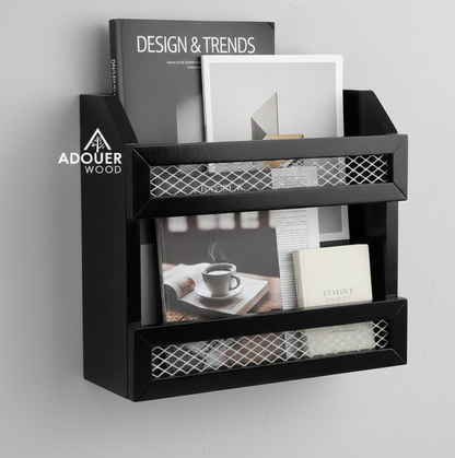 Black wall-mounted magazine rack with books and photos on a gray background, featuring the ADOUER WOOD  brand.