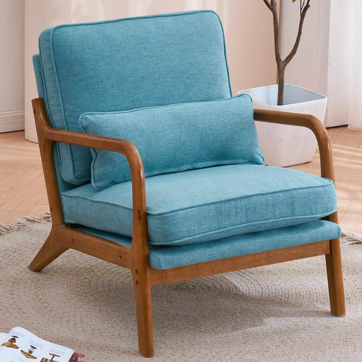 Blue armchair with wooden frame in a room setting
