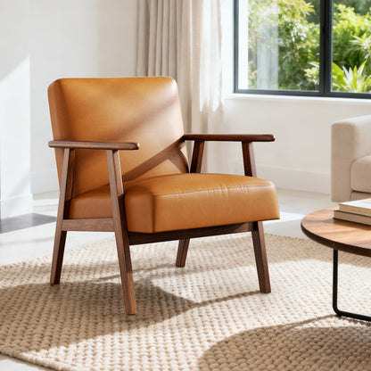Brown leather armchair in a living room setting with a window and rug.