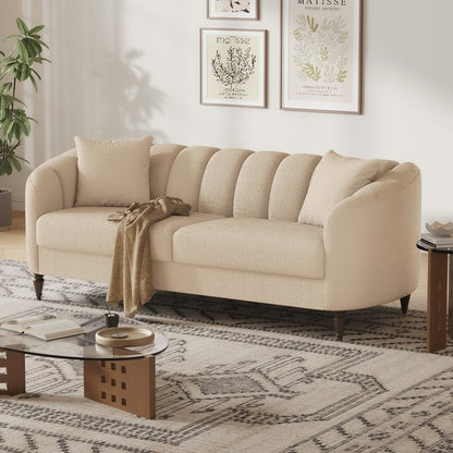 Beige sofa in a living room with a coffee table and decorative elements.