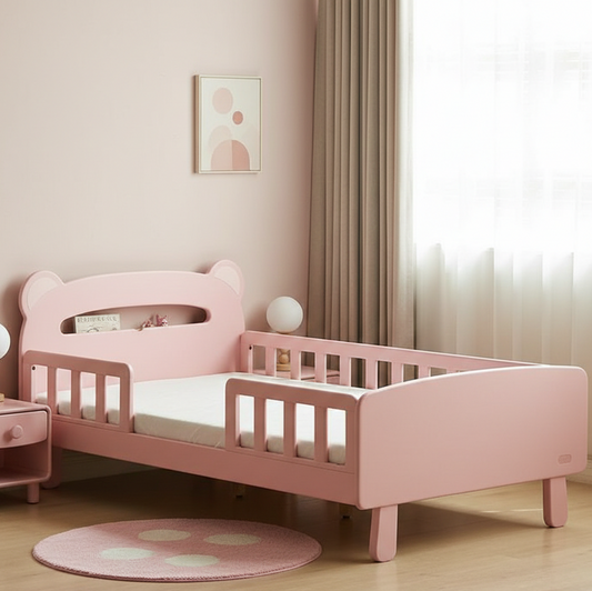 Pink children's bed in a room with a light pink wall and white curtains.