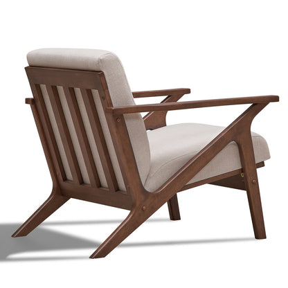Wooden armchair with beige cushion on a white background