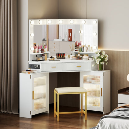 White vanity table with mirror and lights in a bedroom setting