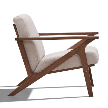 Wooden armchair with beige cushion on a white background