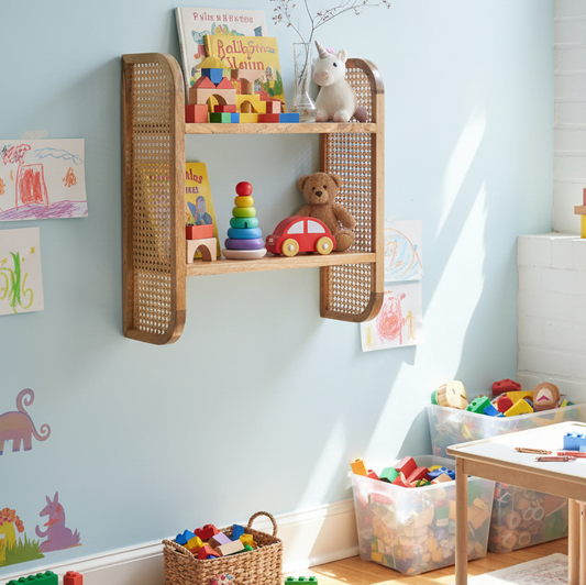 Children's playroom with wooden shelf, toys, and colorful wall art.