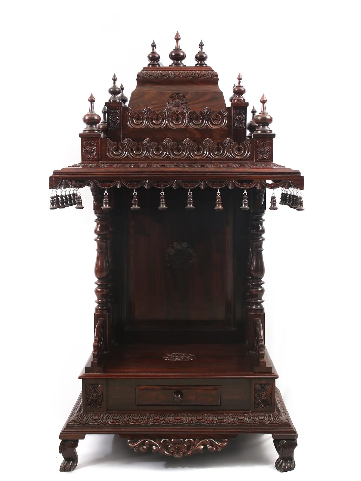 Carved wooden altar with intricate designs on a white background