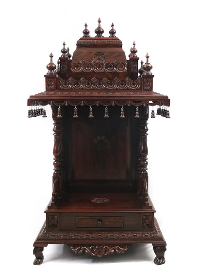 Carved wooden altar with intricate designs on a white background