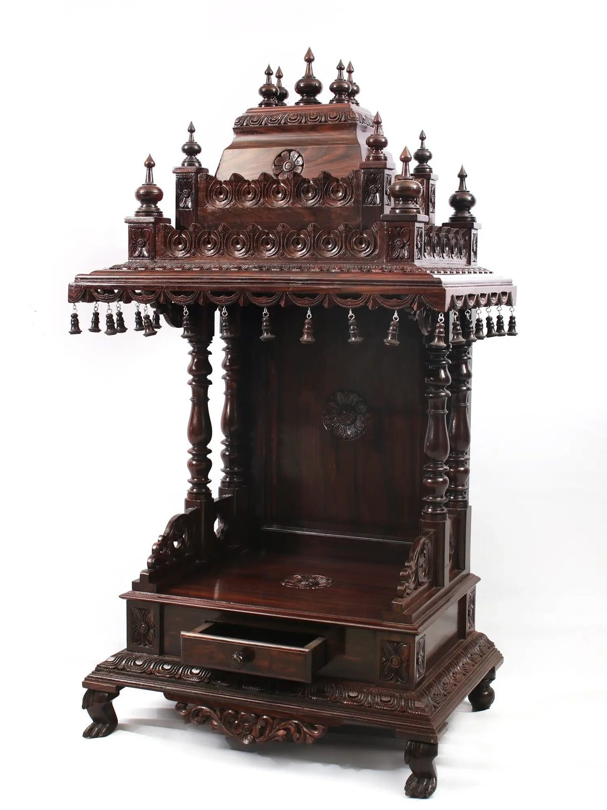 Carved wooden altar with intricate designs on a white background