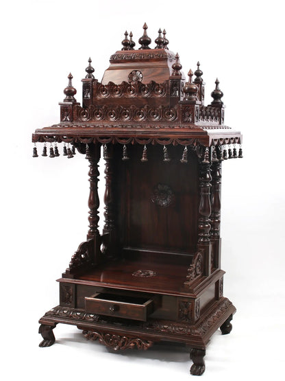 Carved wooden altar with intricate designs on a white background