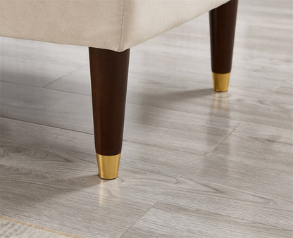 Chair legs with gold tips on a wooden floor