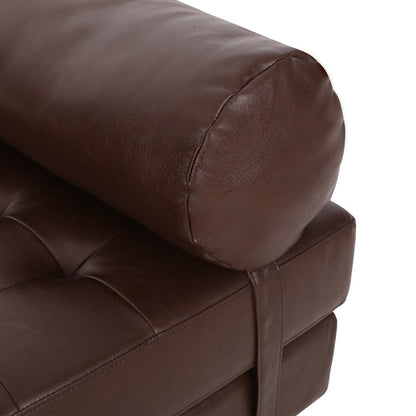 Close-up of a brown leather armchair on a white background