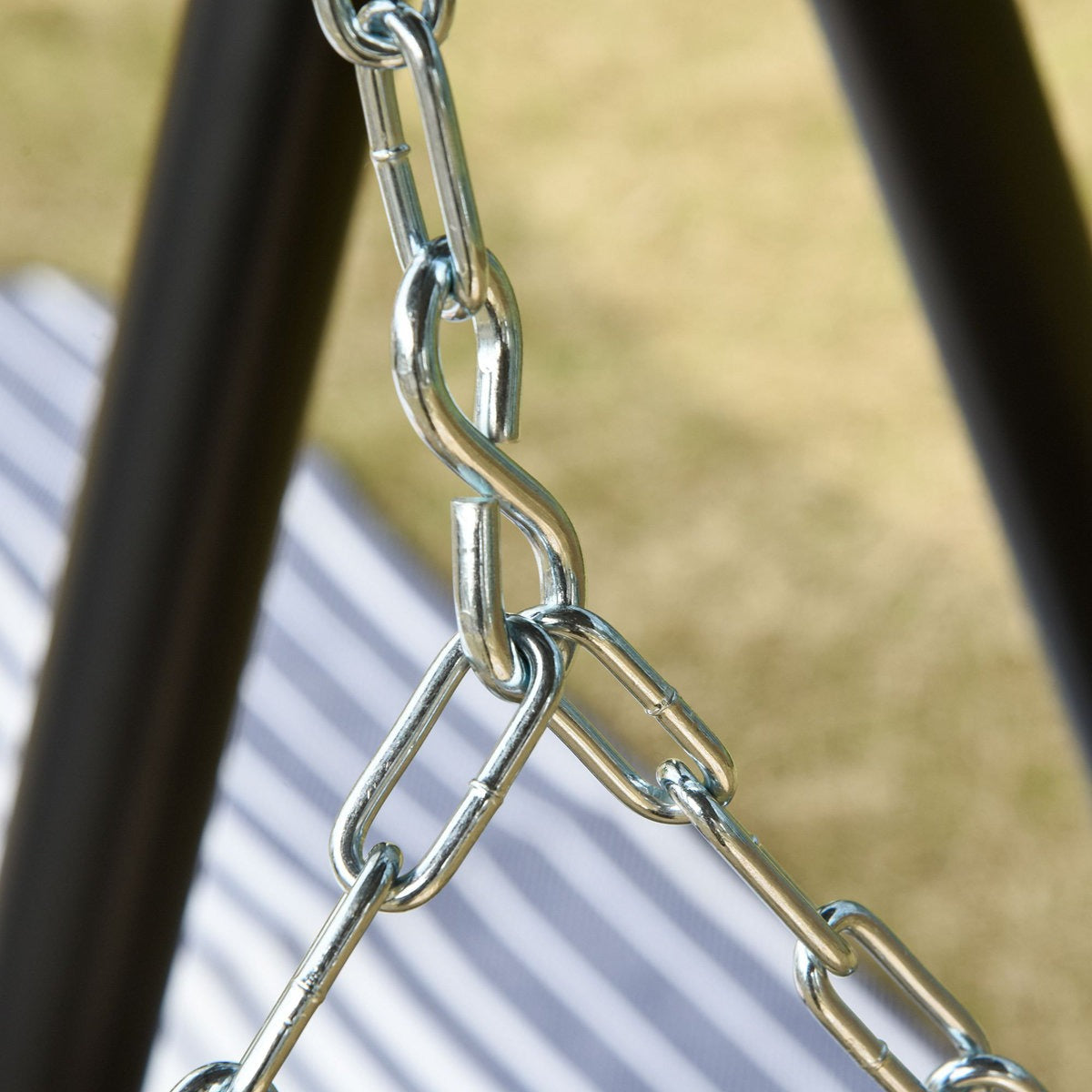 Close-up of a metal chain with a blurred background