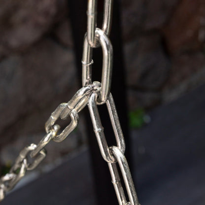 Close-up of a metal chain with a blurred background