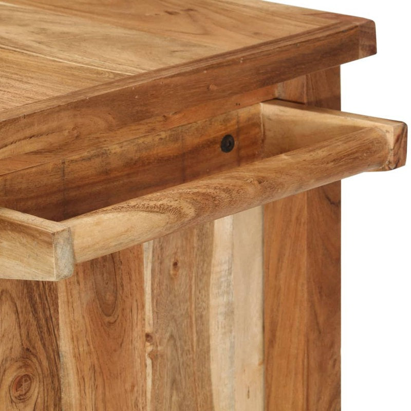 Close-up of a wooden table with a visible drawer.