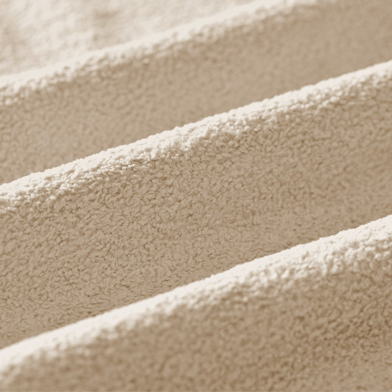 Close-up of beige fabric with a soft texture