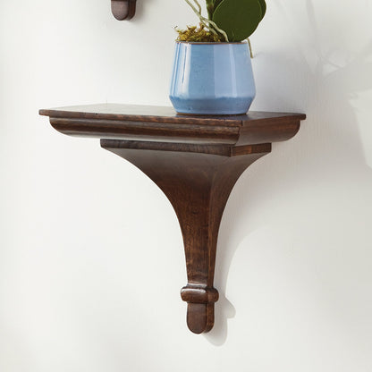 Wooden wall shelf with a blue pot and plant on a white background