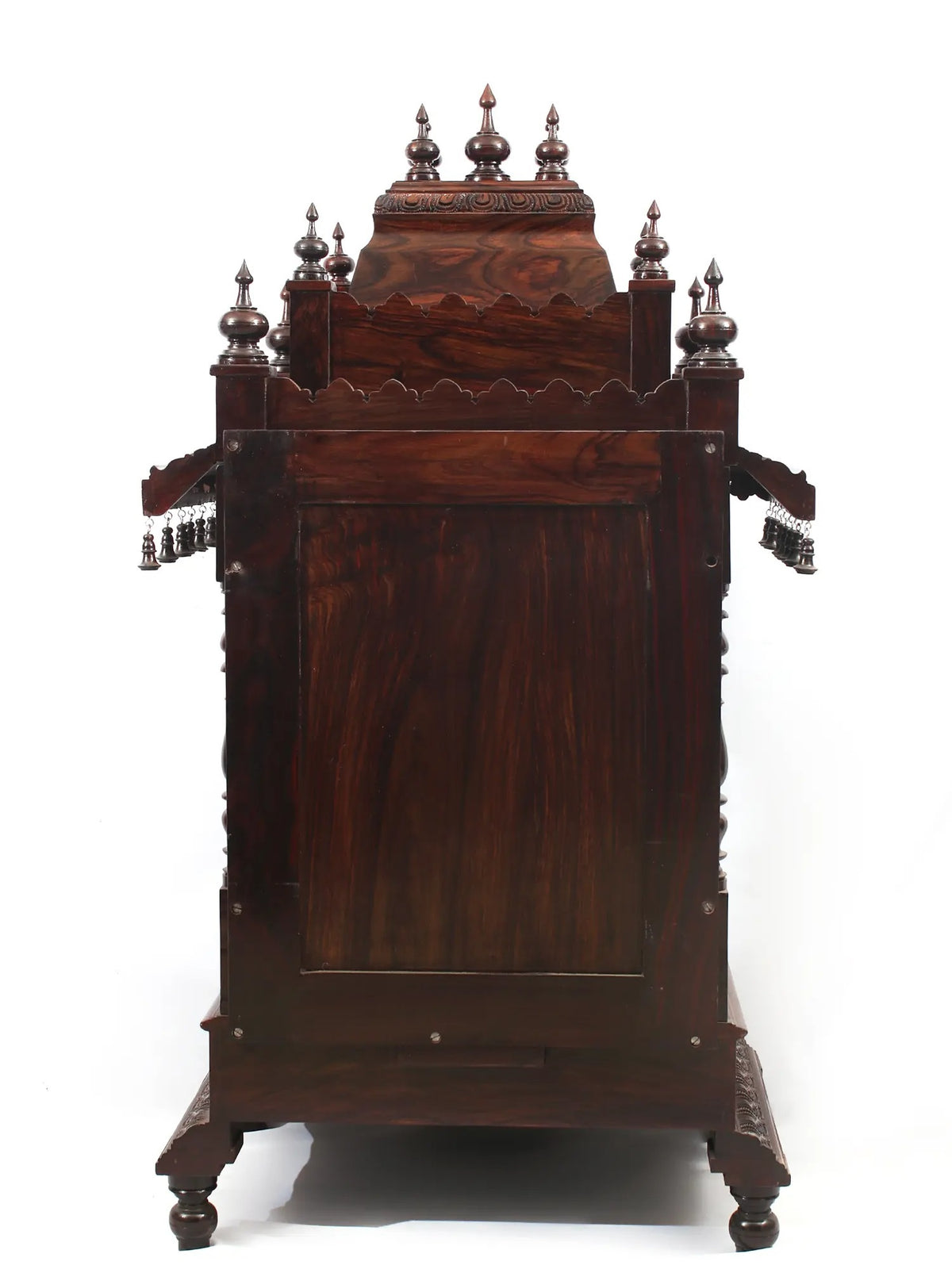 Decorative wooden cabinet with intricate carvings on a white background