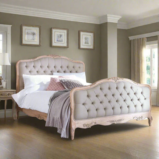 Elegant bedroom with tufted bed and wooden wardrobe